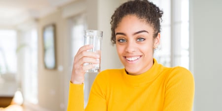 Woman drinking water redmond re-lyte